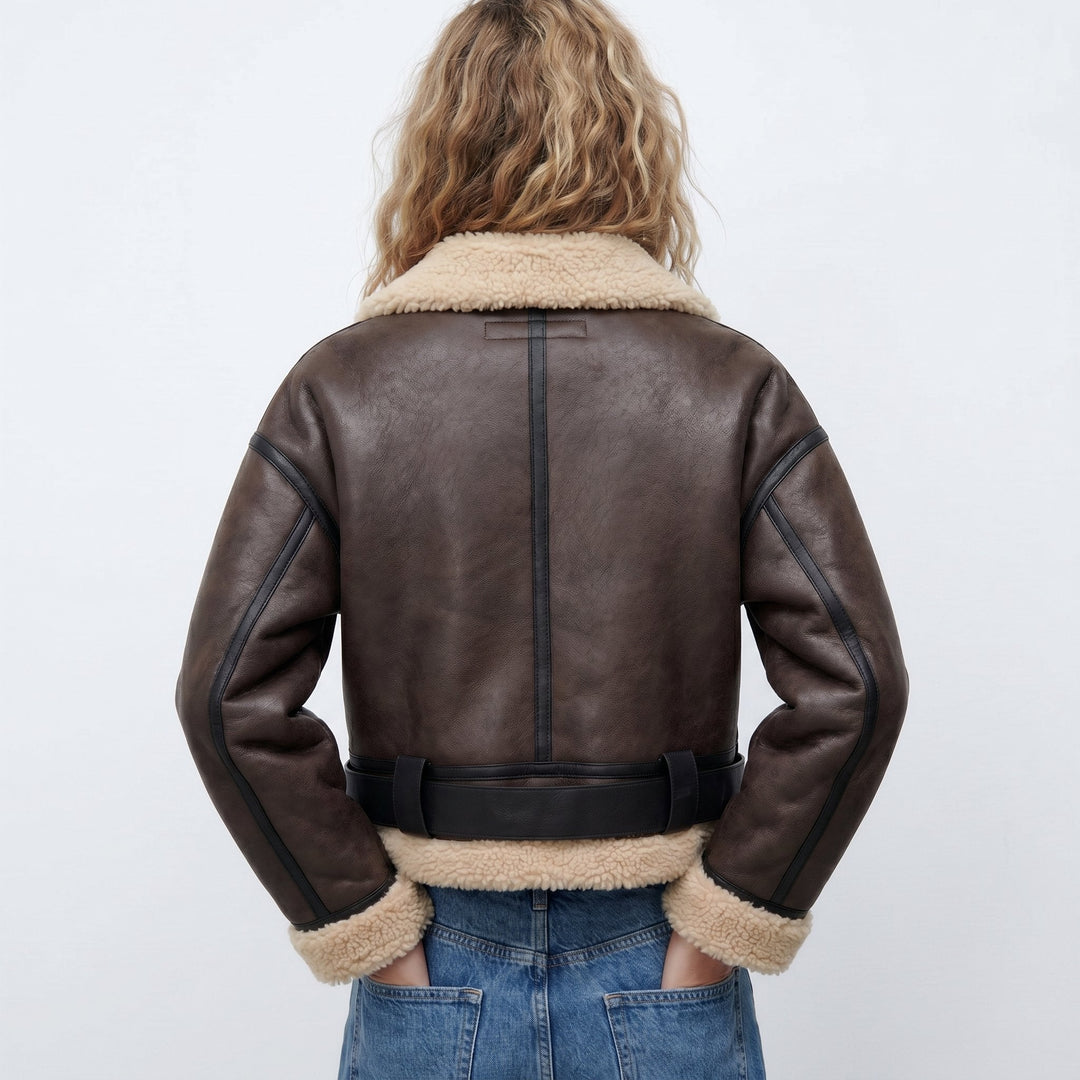 Women's double-sided shearling bomber jacket featuring a thick lining, perfect for versatile winter styling and protection against cold weather. 3