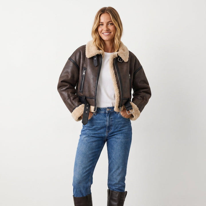 Women's double-sided shearling bomber jacket featuring a thick lining, perfect for versatile winter styling and protection against cold weather. 4