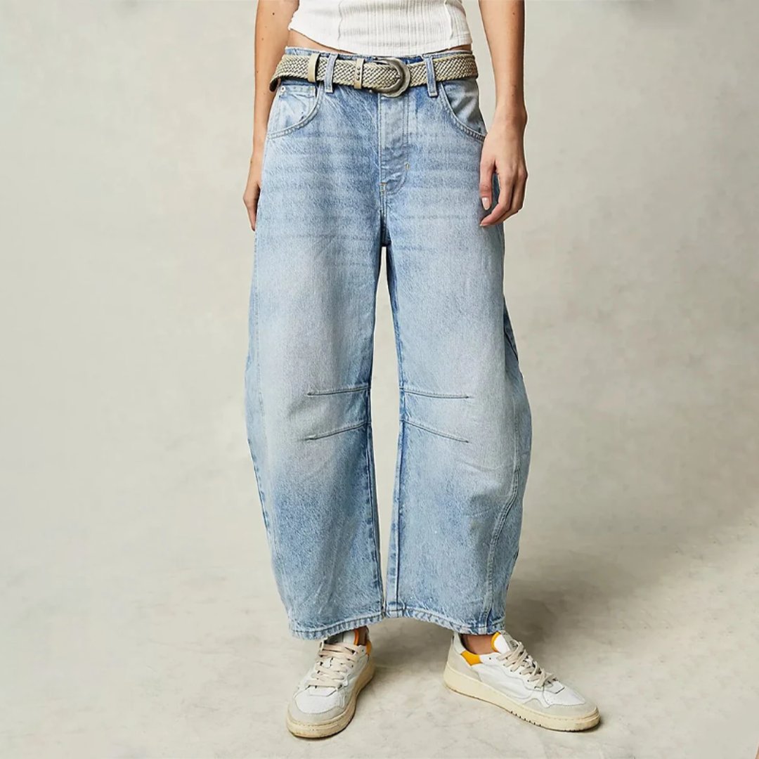 Women's mid-rise cropped barrel leg jeans in heavyweight denim featuring panel-stitched durability, styled in a medium-fade wash. 0