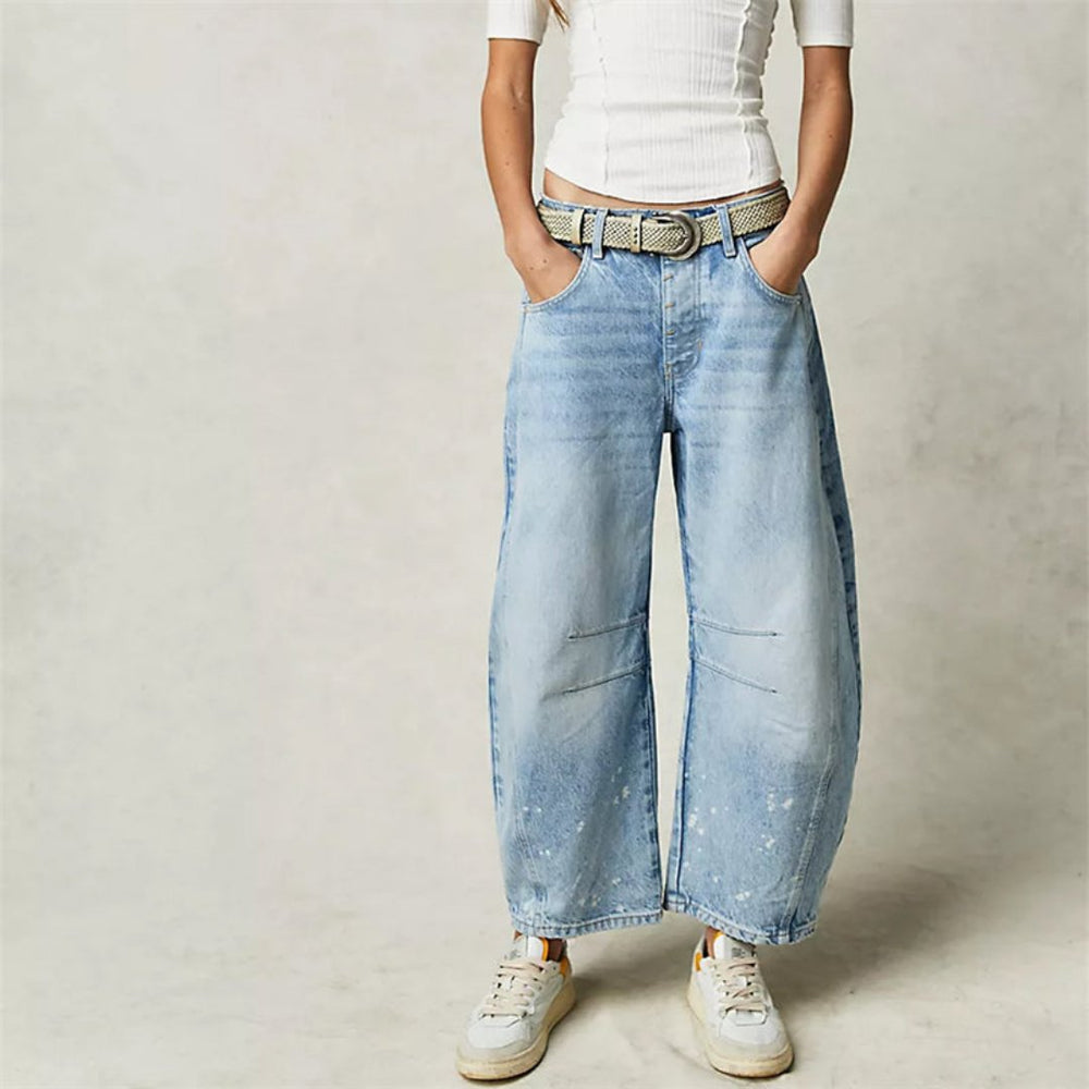 Women's mid-rise cropped barrel leg jeans in heavyweight denim featuring panel-stitched durability, styled in a medium-fade wash. 1