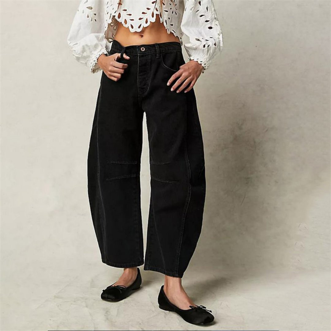 Women's mid-rise cropped barrel leg jeans in heavyweight denim featuring panel-stitched durability, styled in a medium-fade wash. 10