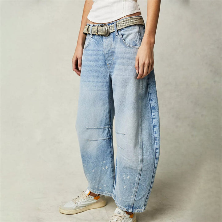 Women's mid-rise cropped barrel leg jeans in heavyweight denim featuring panel-stitched durability, styled in a medium-fade wash. 2