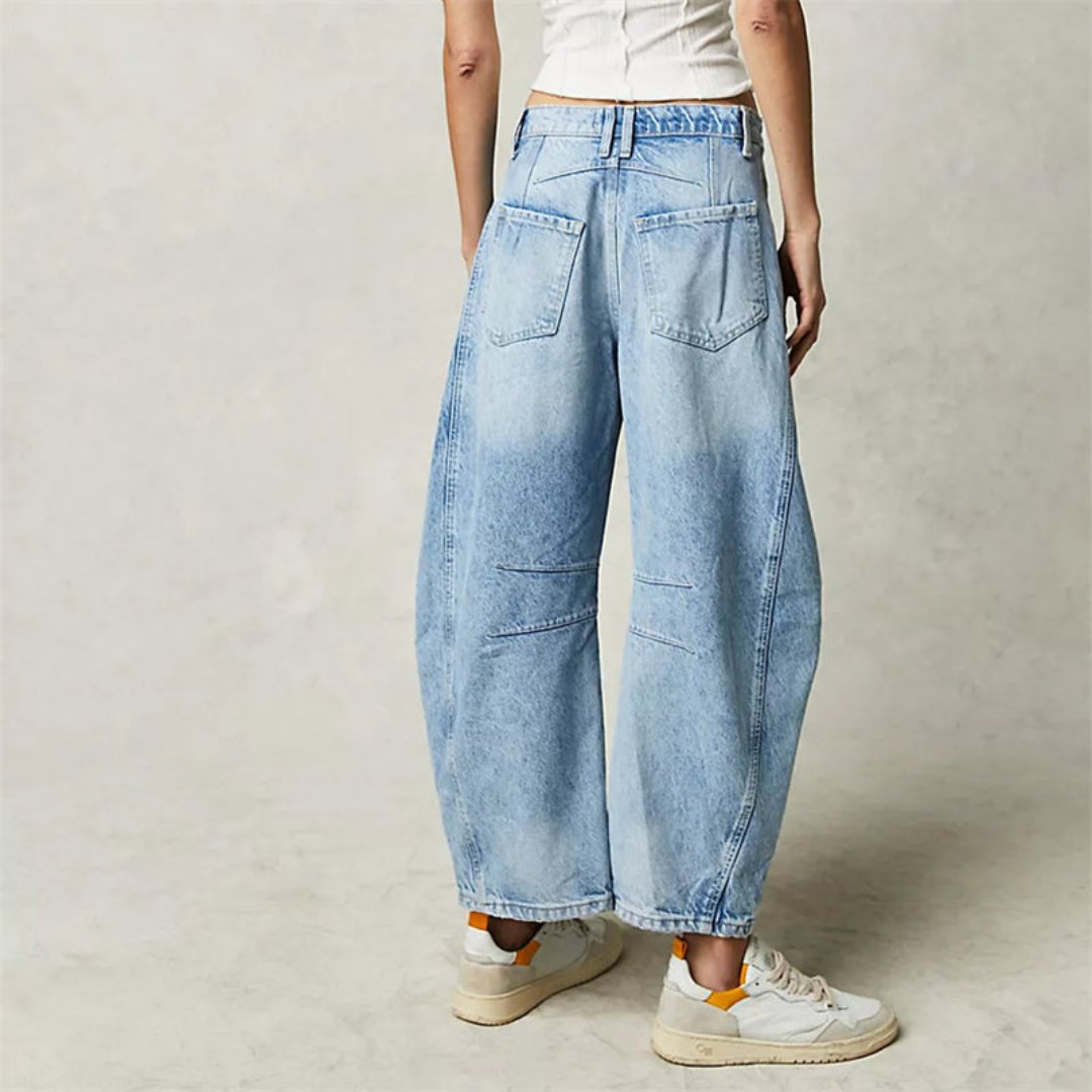 Women's mid-rise cropped barrel leg jeans in heavyweight denim featuring panel-stitched durability, styled in a medium-fade wash. 3
