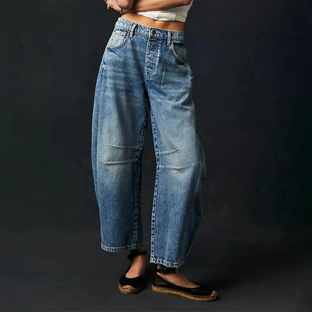 Women's mid-rise cropped barrel leg jeans in heavyweight denim featuring panel-stitched durability, styled in a medium-fade wash. 4