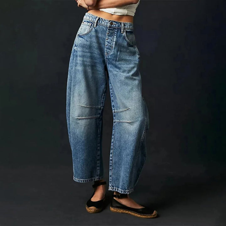 Women's mid-rise cropped barrel leg jeans in heavyweight denim featuring panel-stitched durability, styled in a medium-fade wash. 4