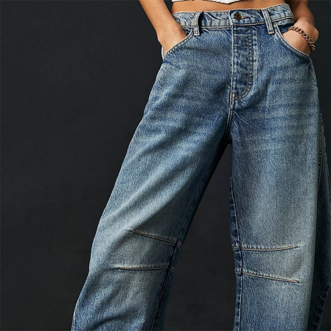 Women's mid-rise cropped barrel leg jeans in heavyweight denim featuring panel-stitched durability, styled in a medium-fade wash. 6