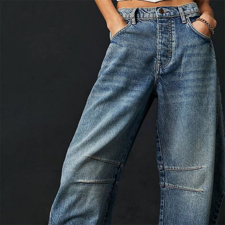 Women's mid-rise cropped barrel leg jeans in heavyweight denim featuring panel-stitched durability, styled in a medium-fade wash. 6