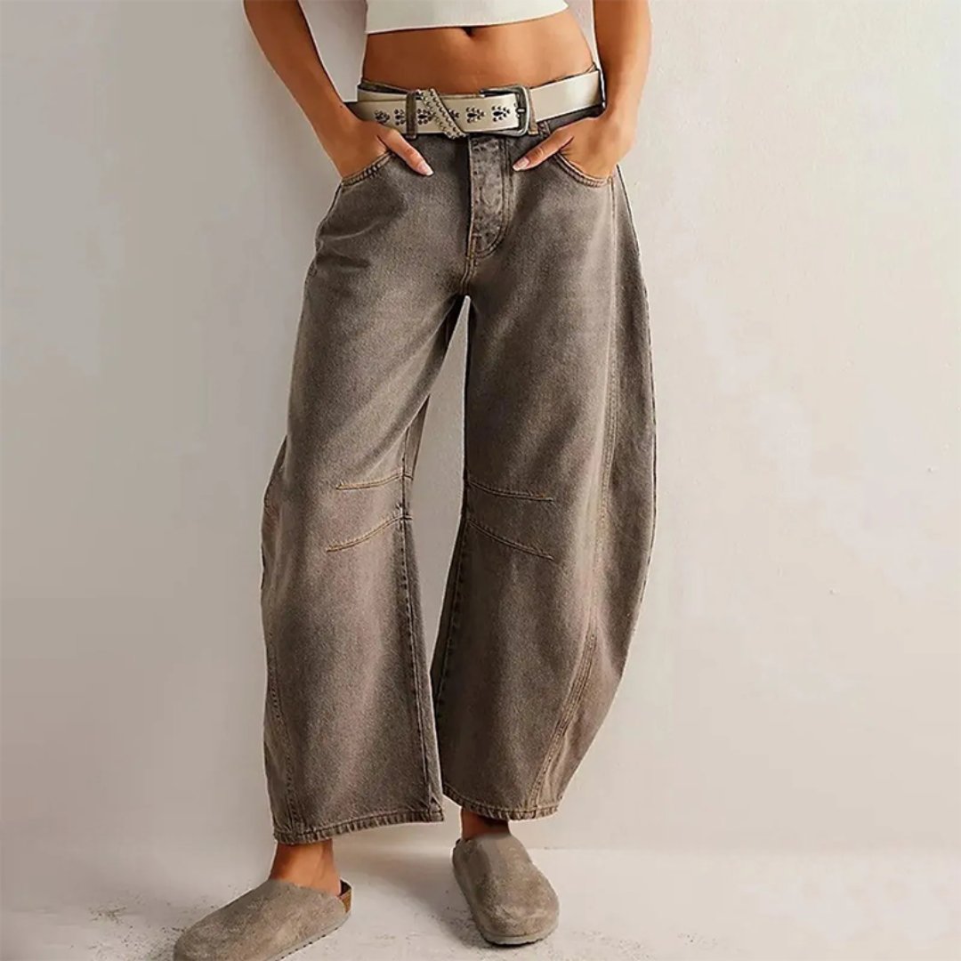 Women's mid-rise cropped barrel leg jeans in heavyweight denim featuring panel-stitched durability, styled in a medium-fade wash. 8