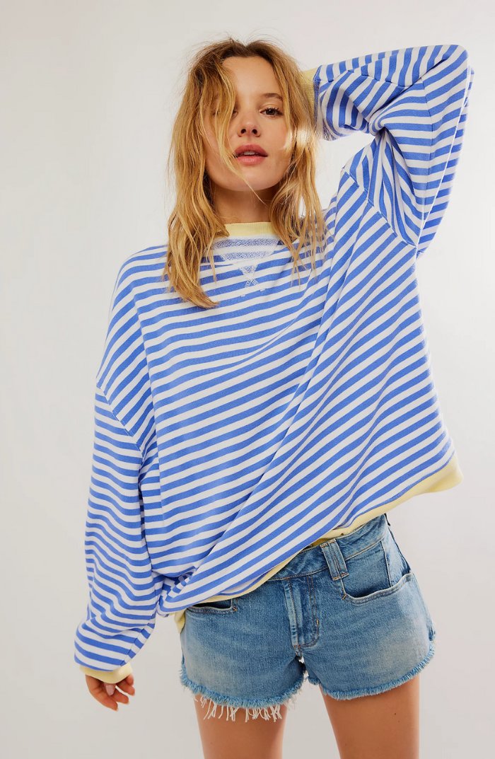 Women's oversized sweatshirt featuring a striped drop-shoulder design with neon contrast trim, made from lightweight knit fabric for comfortable, stylish wear. 2