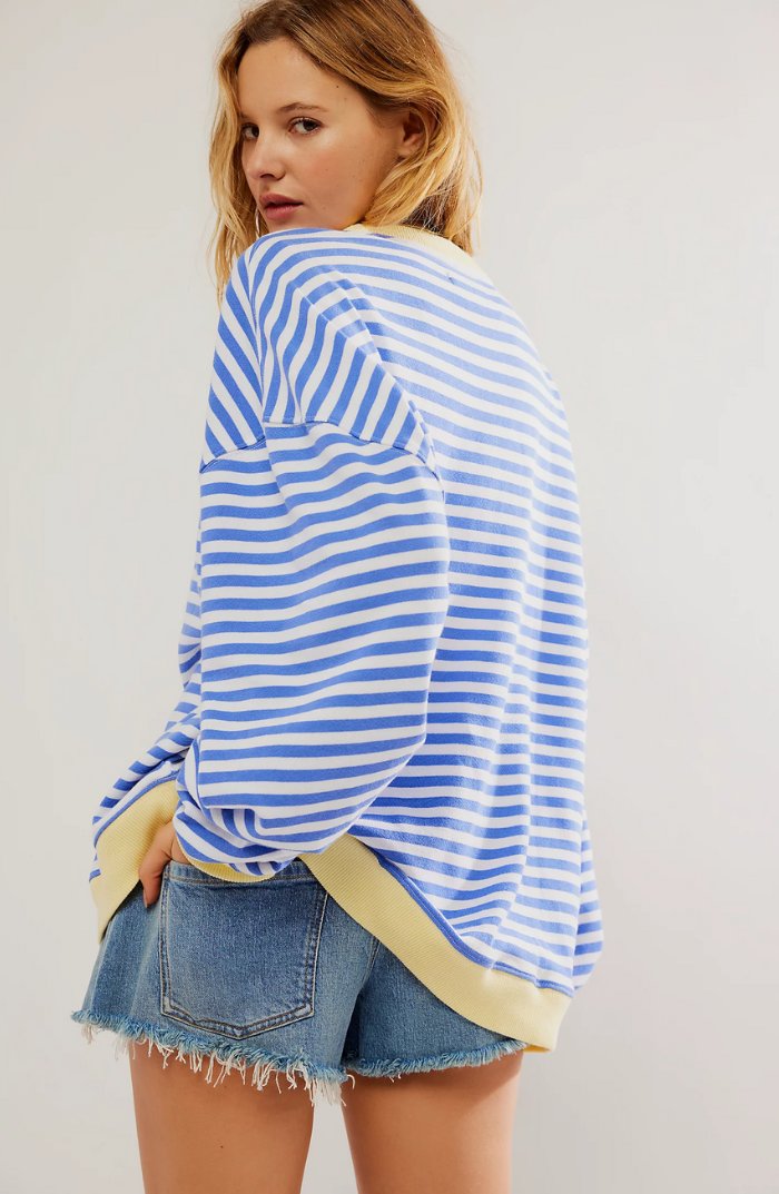 Women's oversized sweatshirt featuring a striped drop-shoulder design with neon contrast trim, made from lightweight knit fabric for comfortable, stylish wear. 3