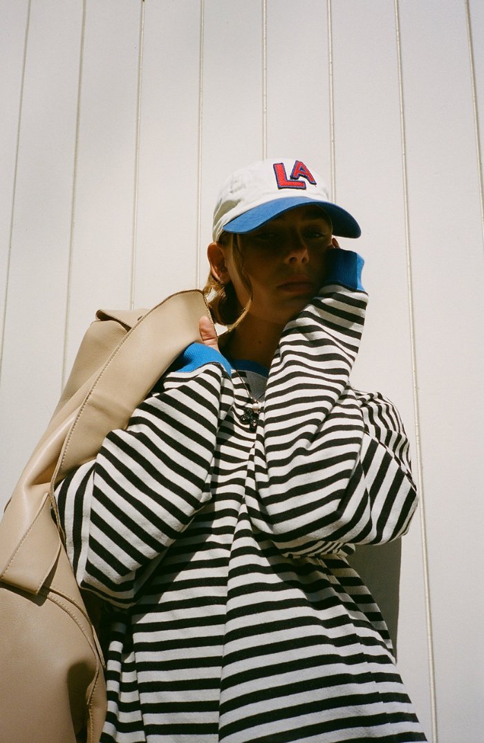 Women's oversized sweatshirt featuring a striped drop-shoulder design with neon contrast trim, made from lightweight knit fabric for comfortable, stylish wear. 9