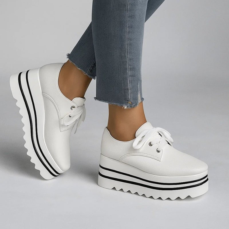 Beige striped women's platform oxford shoes featuring a lace-up closure and stylish wedge sole. 1