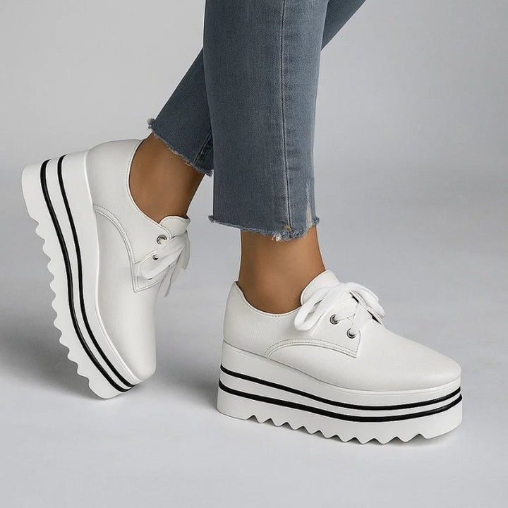 Beige striped women's platform oxford shoes featuring a lace-up closure and stylish wedge sole. 1