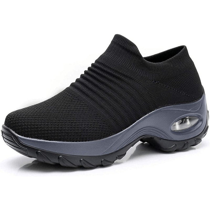 Women's slip-on sneakers featuring air cushion technology and a breathable knit design, perfect for all-day comfort and style. 0