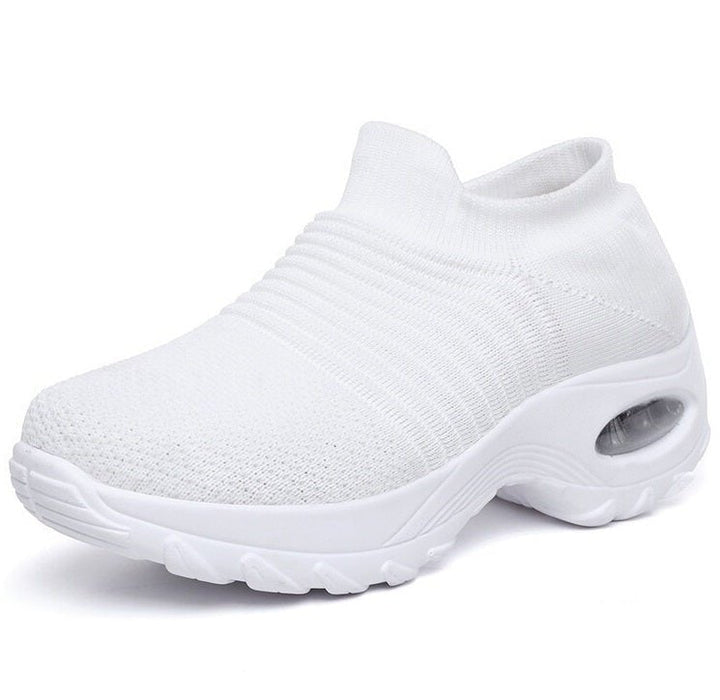 Women's slip-on sneakers featuring air cushion technology and a breathable knit design, perfect for all-day comfort and style. 4