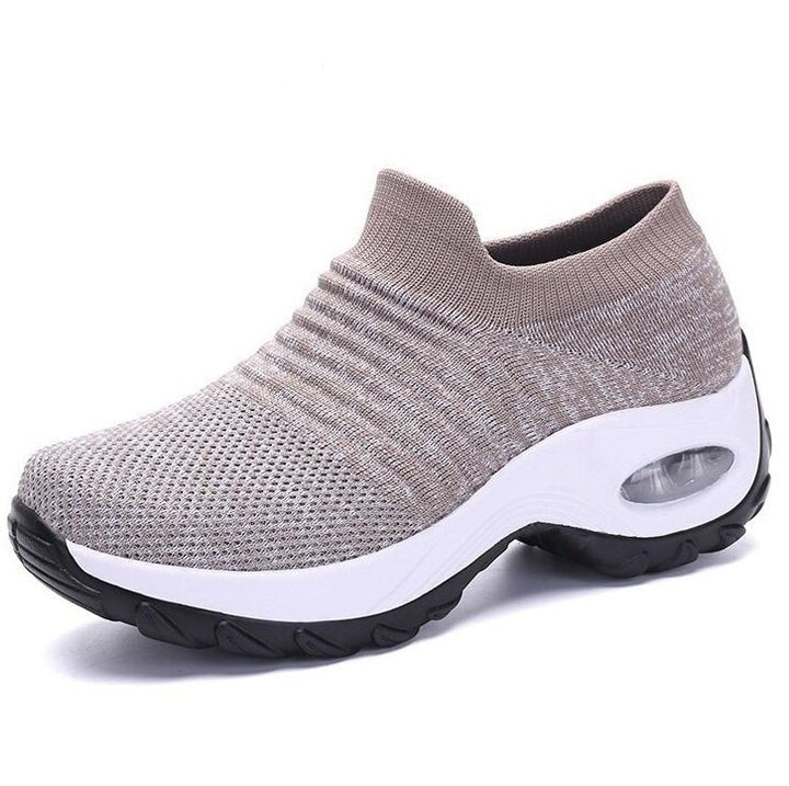 Women's slip-on sneakers featuring air cushion technology and a breathable knit design, perfect for all-day comfort and style. 5
