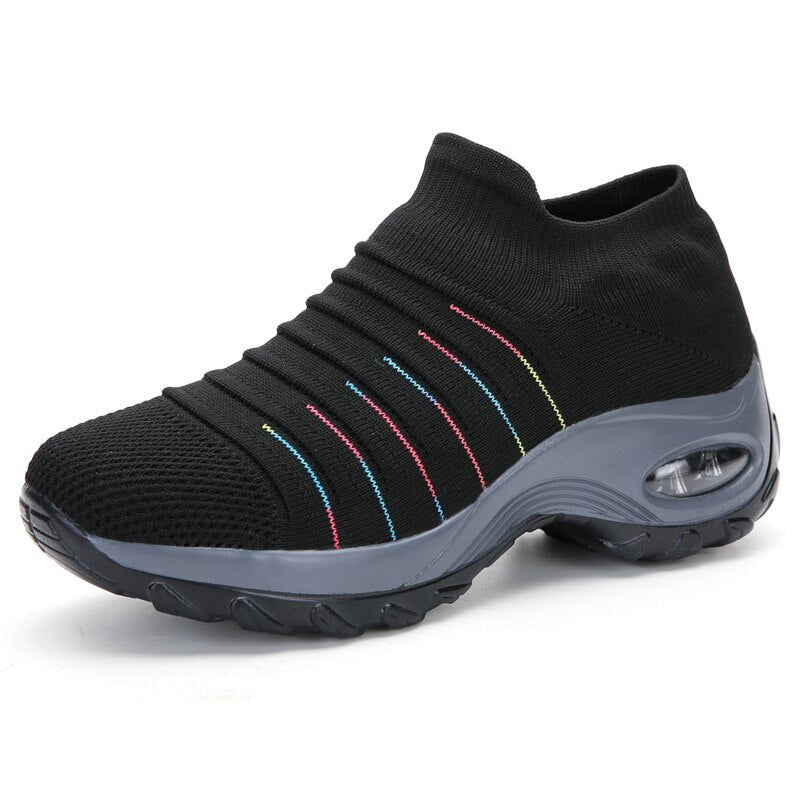 Women's slip-on sneakers featuring air cushion technology and a breathable knit design, perfect for all-day comfort and style. 7