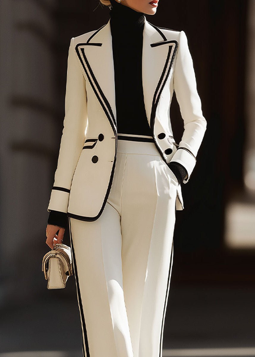 Women's suit set featuring a tailored double-breasted blazer and stylish wide-leg pants, perfect for structured professional attire in a modern workplace. 2