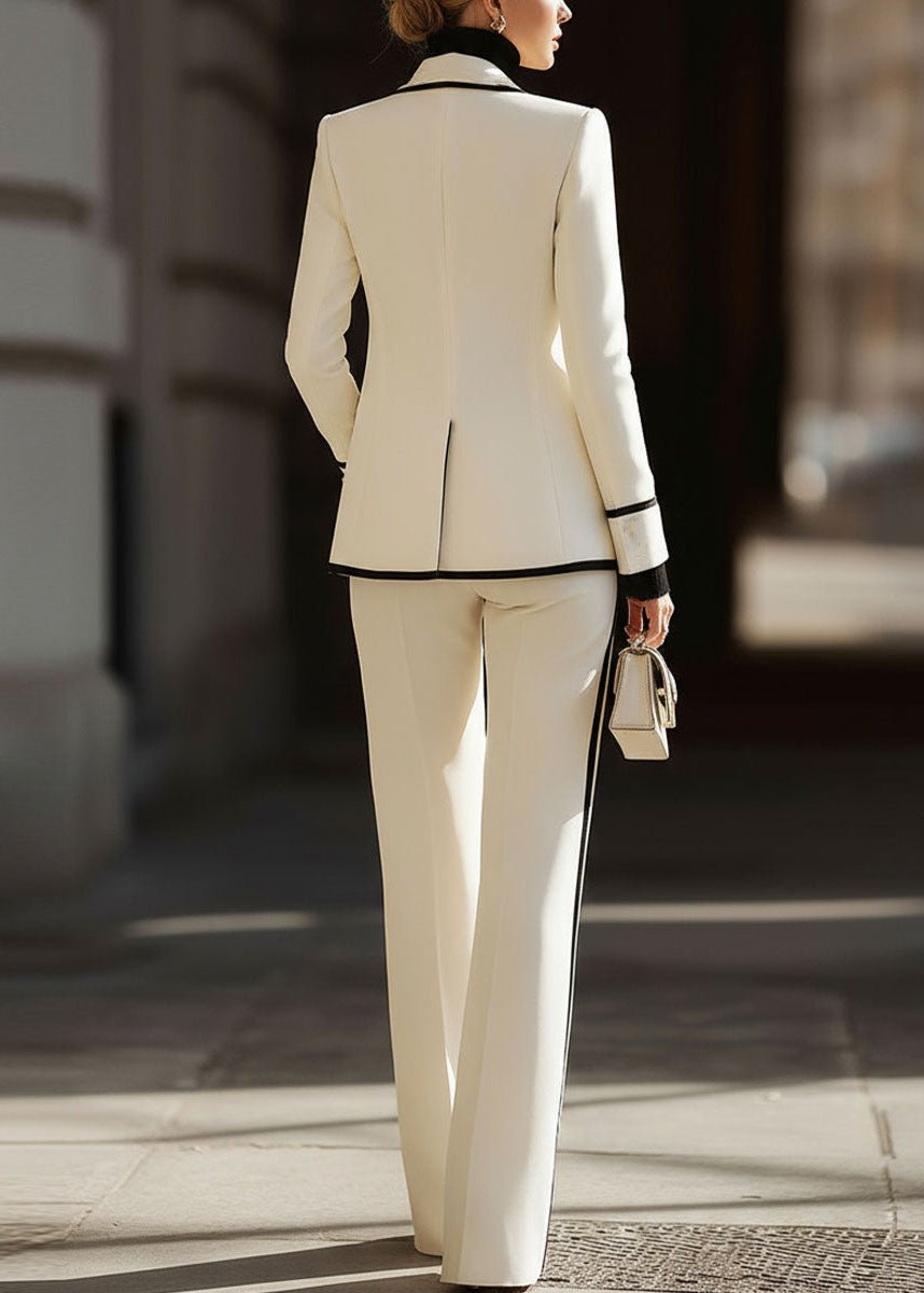 Women's suit set featuring a tailored double-breasted blazer and stylish wide-leg pants, perfect for structured professional attire in a modern workplace. 4