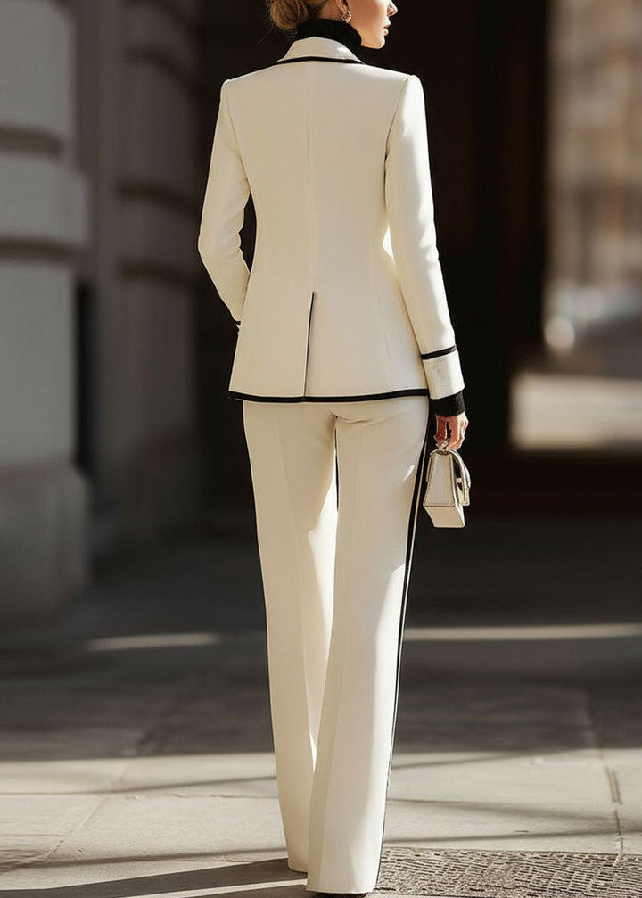 Women's suit set featuring a tailored double-breasted blazer and stylish wide-leg pants, perfect for structured professional attire in a modern workplace. 4
