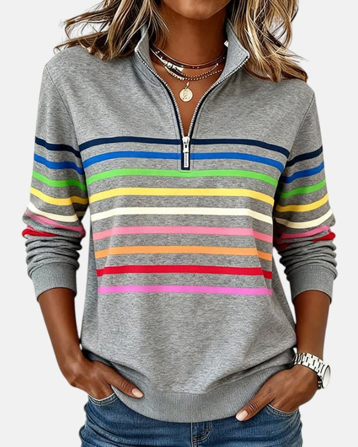 Women's relaxed fit cotton blend sweatshirt featuring a quarter zip design and vibrant rainbow stripes, perfect for casual outings and comfortable layering. 0