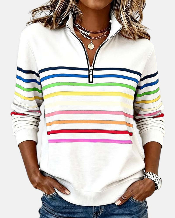 Women's relaxed fit cotton blend sweatshirt featuring a quarter zip design and vibrant rainbow stripes, perfect for casual outings and comfortable layering. 2