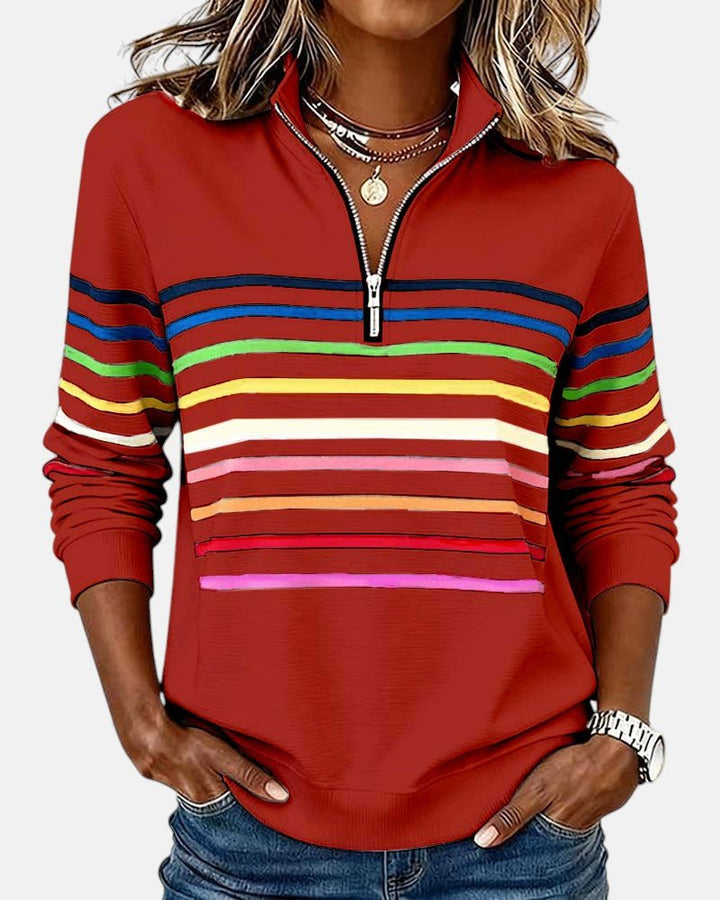 Women's relaxed fit cotton blend sweatshirt featuring a quarter zip design and vibrant rainbow stripes, perfect for casual outings and comfortable layering. 3