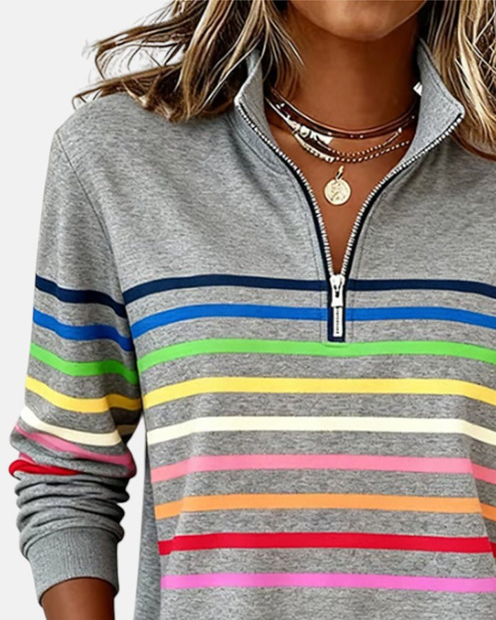 Women's relaxed fit cotton blend sweatshirt featuring a quarter zip design and vibrant rainbow stripes, perfect for casual outings and comfortable layering. 6