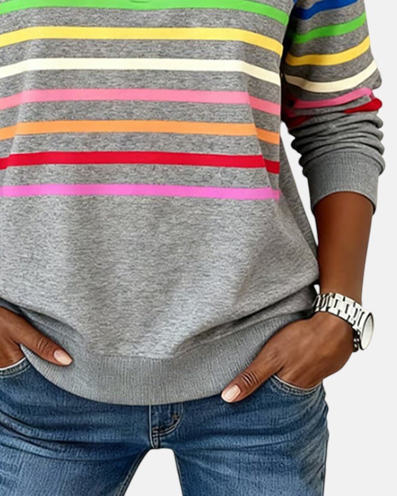 Women's relaxed fit cotton blend sweatshirt featuring a quarter zip design and vibrant rainbow stripes, perfect for casual outings and comfortable layering. 7