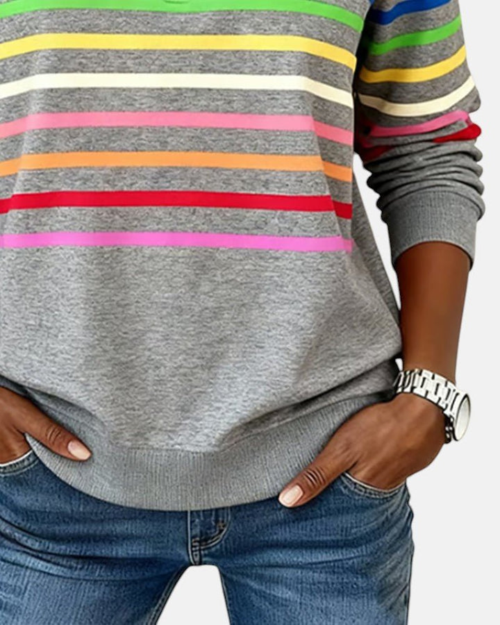 Women's relaxed fit cotton blend sweatshirt featuring a quarter zip design and vibrant rainbow stripes, perfect for casual outings and comfortable layering. 7