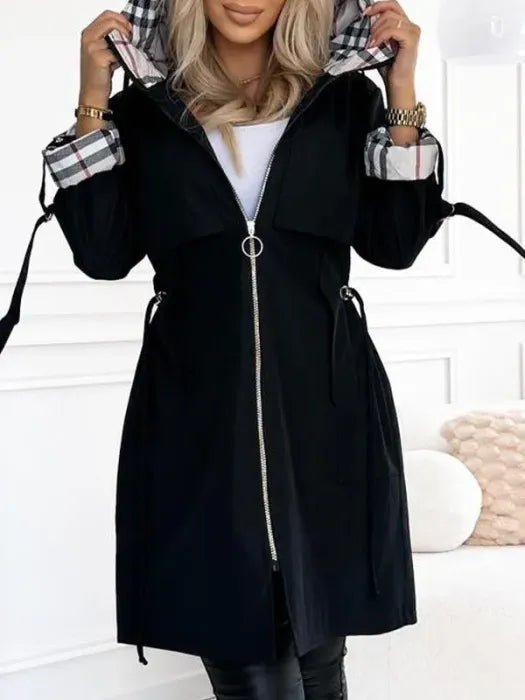Women's waterproof trench coat featuring a windproof design and tailored fit, ideal for all weather conditions, with a stylish hood for added protection. 2