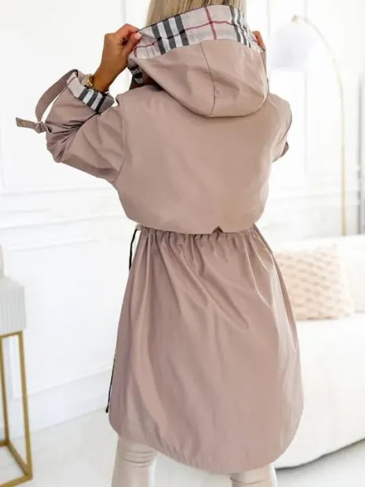 Women's waterproof trench coat featuring a windproof design and tailored fit, ideal for all weather conditions, with a stylish hood for added protection. 3
