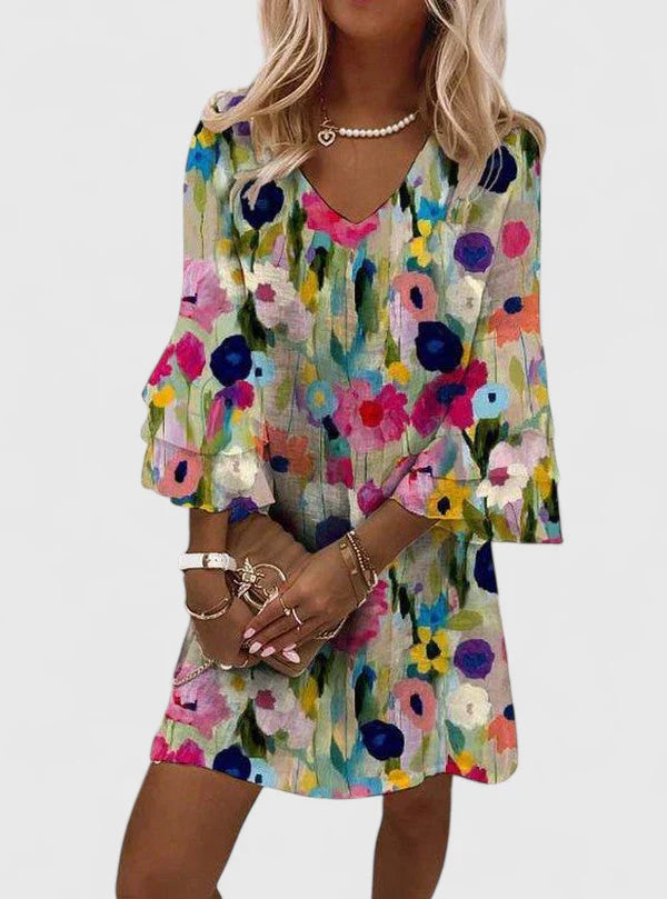 Womens floral mini dress with V-neckline and comfortable fit, perfect for wedding guests and summer cocktails. 0