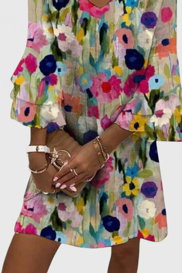 Womens floral mini dress with V-neckline and comfortable fit, perfect for wedding guests and summer cocktails. 1