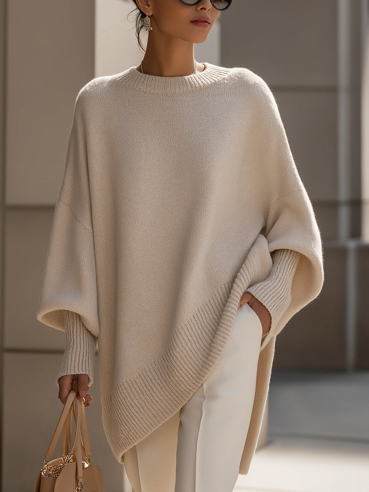 Wool blend oversized sweater with asymmetrical hem, featuring a cozy and elegant design, perfect for stylish layering in cooler weather. 0