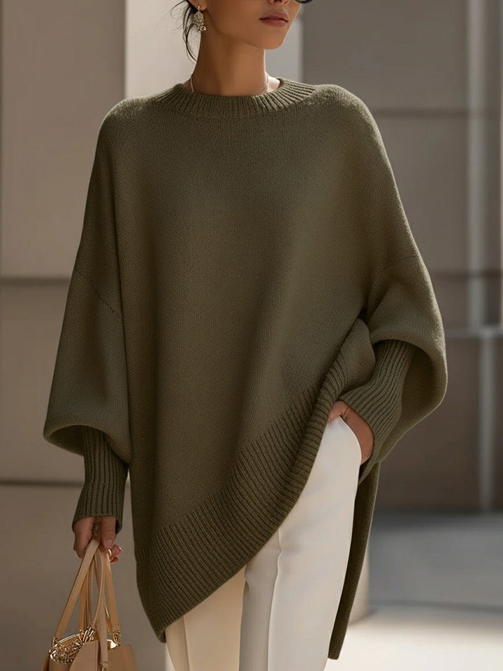 Wool blend oversized sweater with asymmetrical hem, featuring a cozy and elegant design, perfect for stylish layering in cooler weather. 10