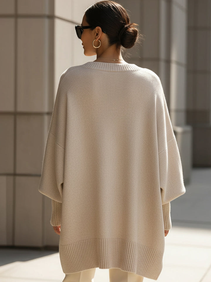 Wool blend oversized sweater with asymmetrical hem, featuring a cozy and elegant design, perfect for stylish layering in cooler weather. 3