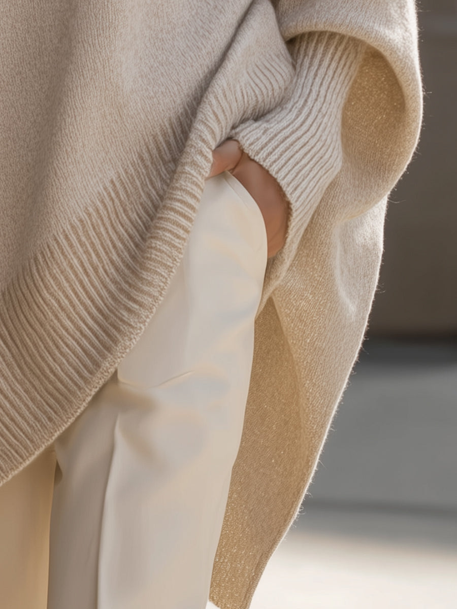 Wool blend oversized sweater with asymmetrical hem, featuring a cozy and elegant design, perfect for stylish layering in cooler weather. 4