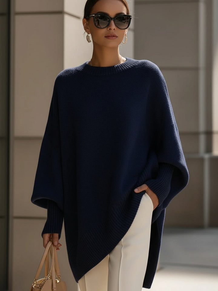 Wool blend oversized sweater with asymmetrical hem, featuring a cozy and elegant design, perfect for stylish layering in cooler weather. 6