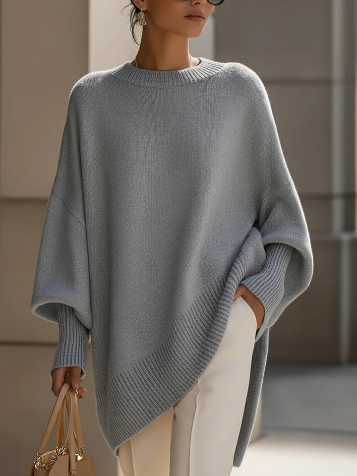 Wool blend oversized sweater with asymmetrical hem, featuring a cozy and elegant design, perfect for stylish layering in cooler weather. 8