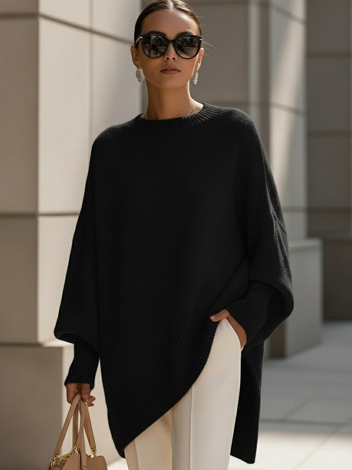 Wool blend oversized sweater with asymmetrical hem, featuring a cozy and elegant design, perfect for stylish layering in cooler weather. 9
